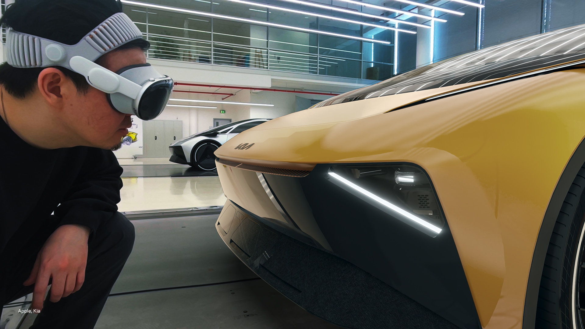 Apple Vision Pro를 착용한 사용자가 기아 자동차의 전면부를 근거리에서 관찰하는 모습이다.