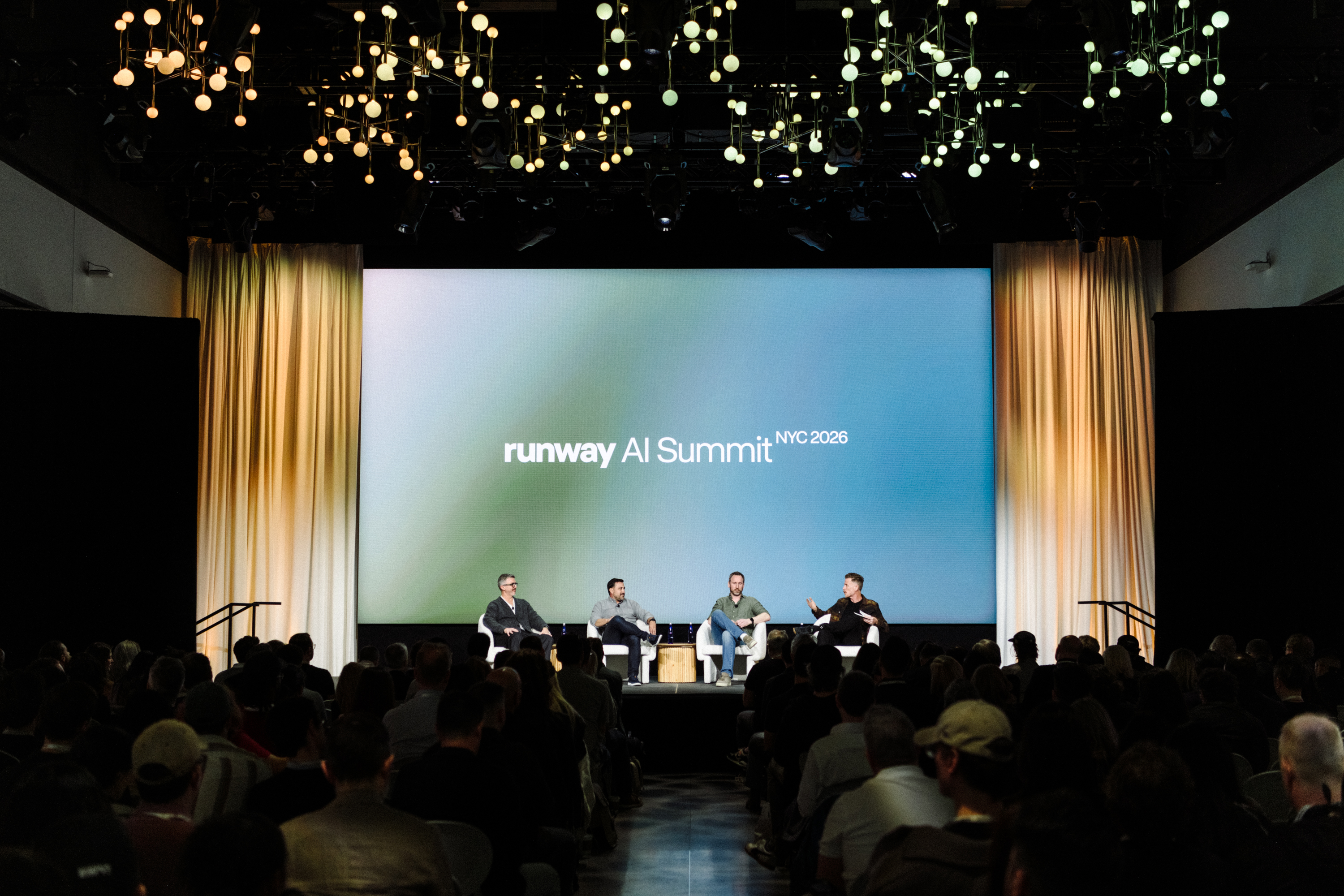 컨퍼런스 무대 사진에 'runway AI Summit NYC 2026' 배경이 보이며 패널 토론 장면을 담고 있습니다.
